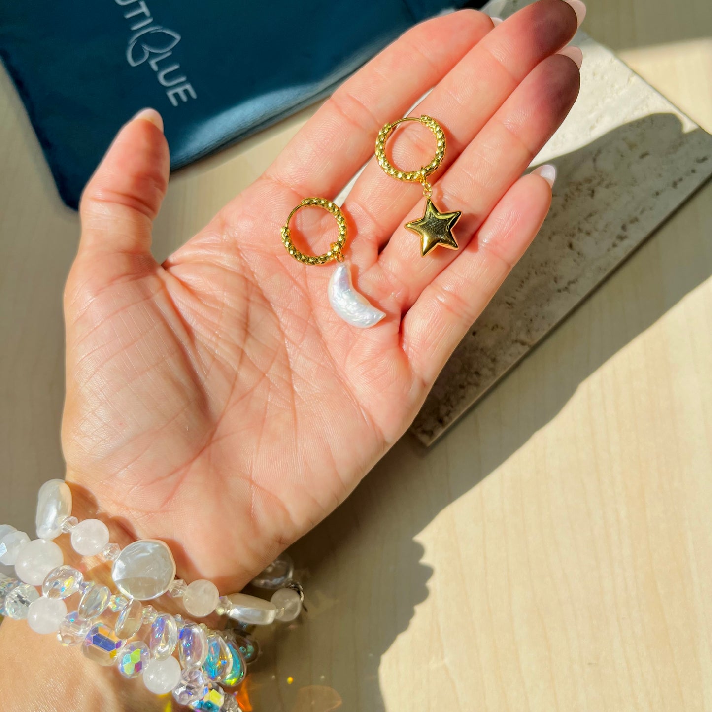MISMATCHED MOON & STAR HUGGIE HOOP EARRINGS
