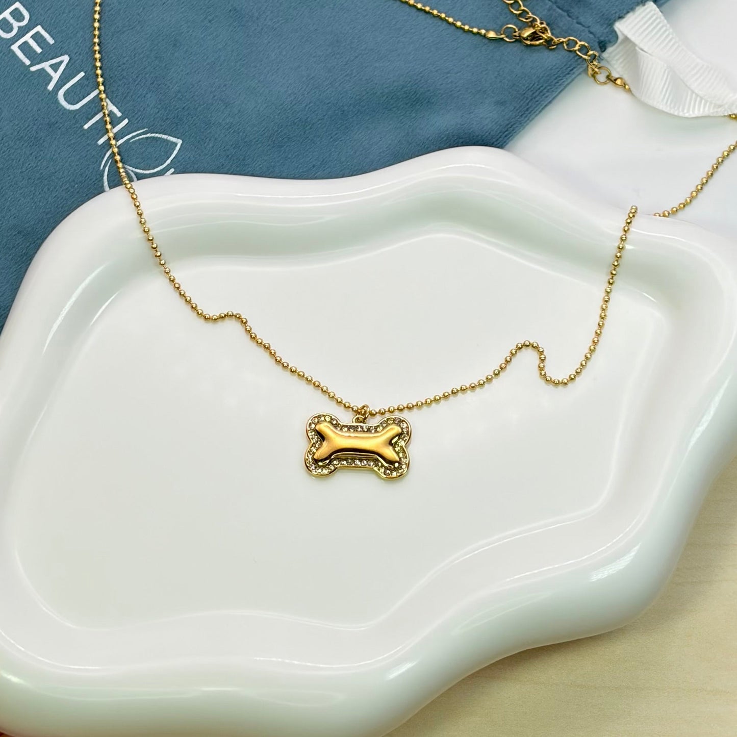 BONE DOG PENDANT NECKLACE